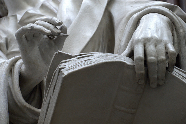 Statue Writing in a Book