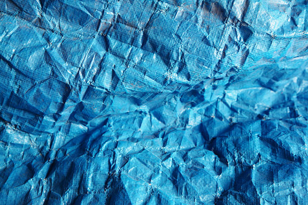 Blue wrinkled tarp. Photo by Pink Sherbet Photography