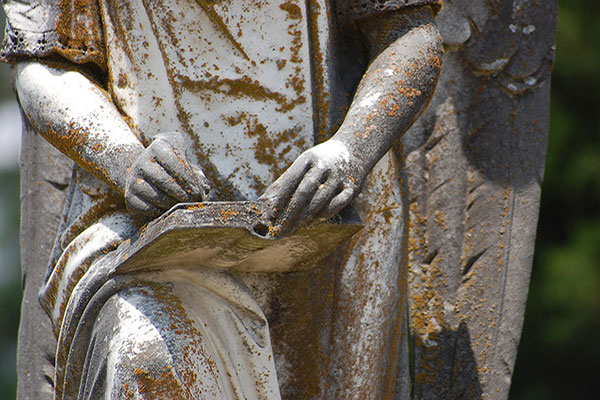 Statue hand writing. Photo by Marsha Brockman/Flickr