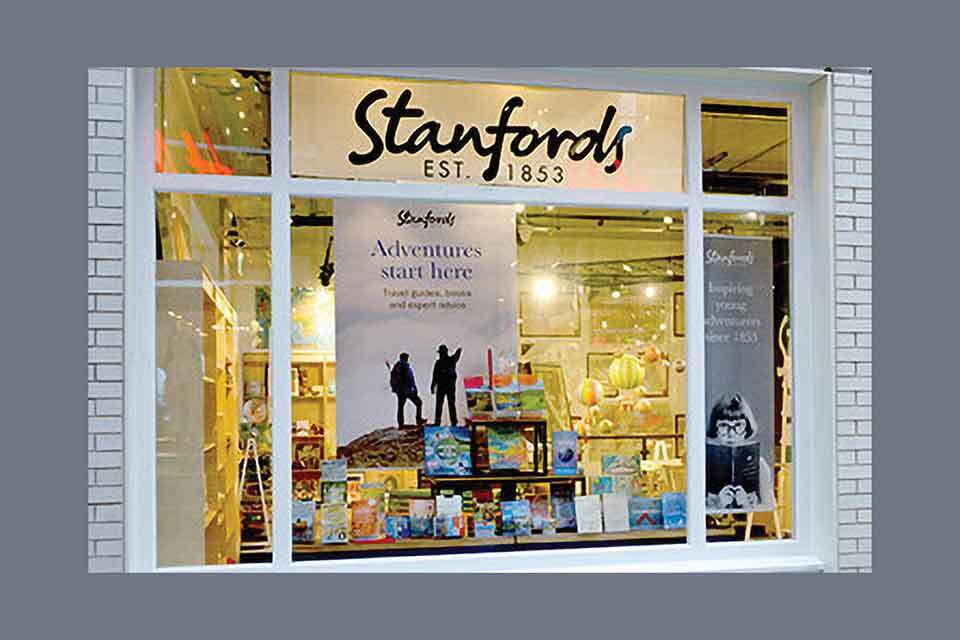 A photograph of a bookstore window. Text reads: Standfords