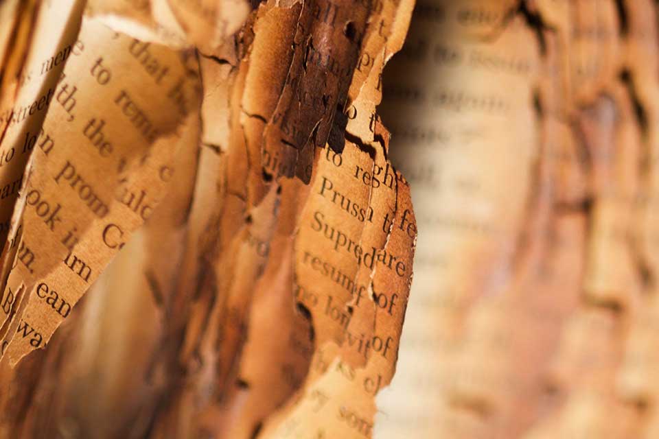 A close-up photograph of a partially burned book