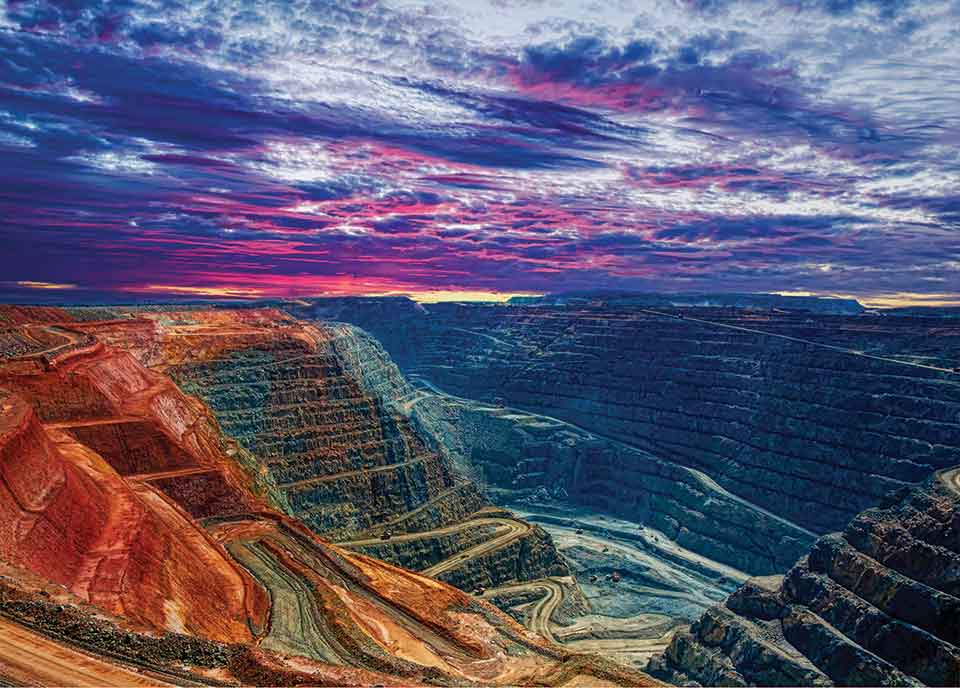 A digitally altered photograph of a hewn quarry underneath a purpled sky