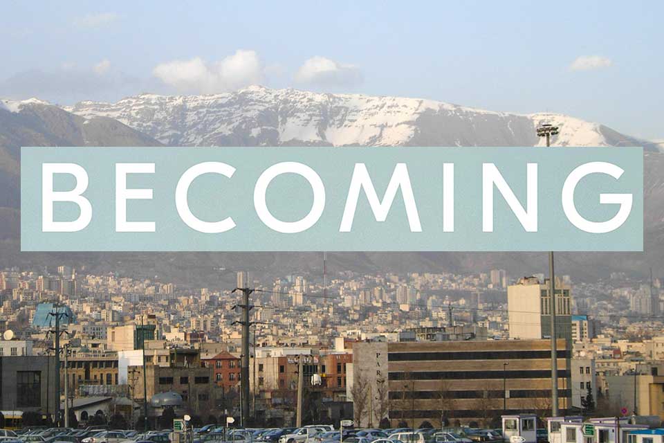 A photograph of the Tehran city skyline with the logo of Michelle Obama's book Becoming hovering just above the buildings