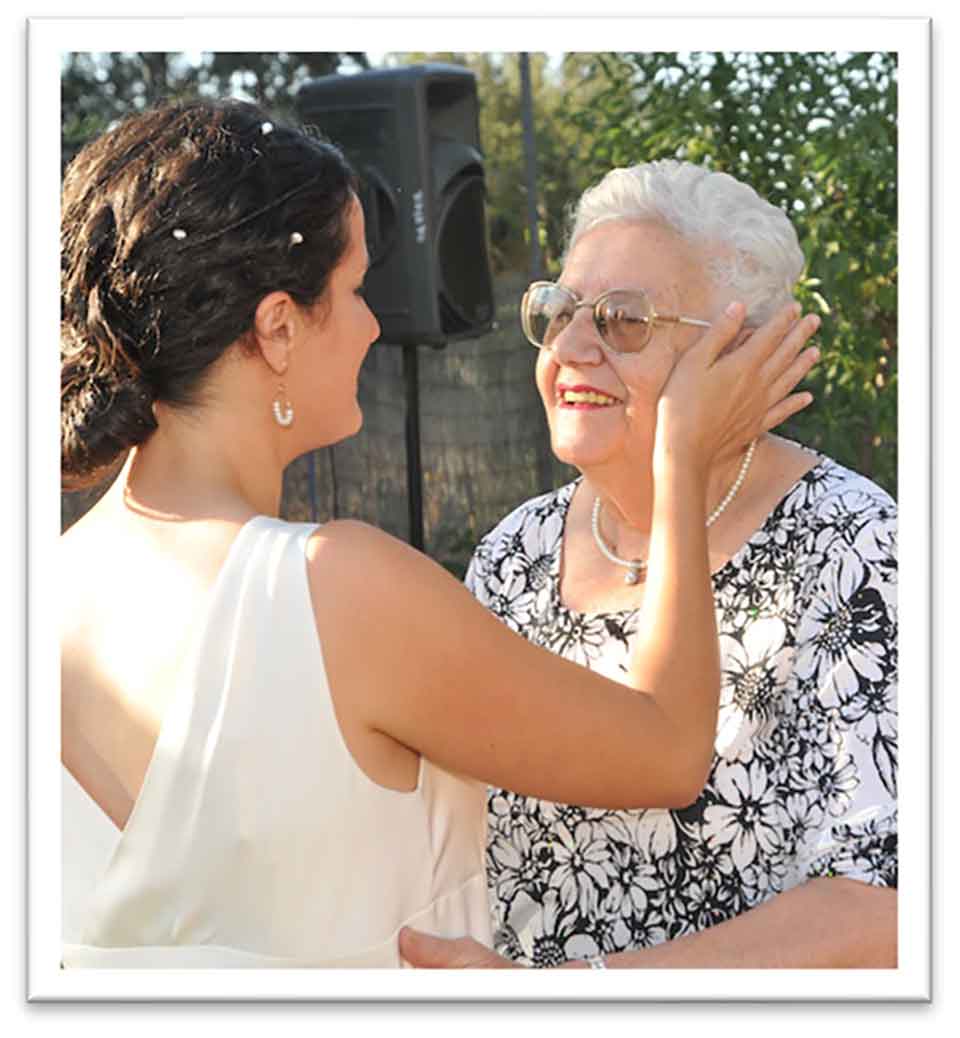 A color photograph of the author, dressed in wedding garb, with her grandmother