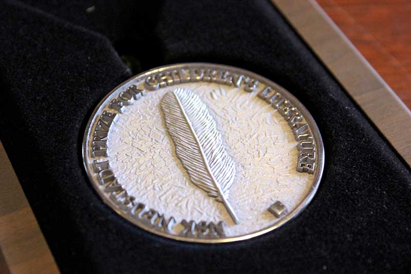 A close-up photo of the NSK medal