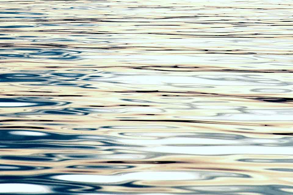 A close-up detail of sunlight on a body of water