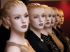 A row of mannequin busts with the same face but different outfits