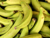 A photographic close-up of nearly ripe bananas