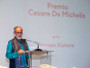 A photograph with a man standing at a lectern