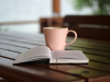 Coffee and a book on a table