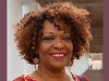 A photograph of Rita Dove, who is smiling while looking at the photographer