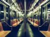 A photograph of the long interior of a subway car