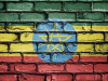 The flag of Ethiopia spray painted on a brick wall