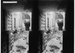 A double exposure of a bombed out alley as seen through a doorway