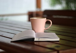 Coffee and a book on a table