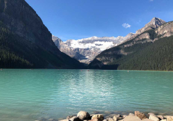 Snow-capped mountains frame a lake