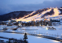 A snowy hillside landscape with the city of PyongCheong at its base.