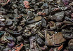 A photograph of a pile of discarded shoes