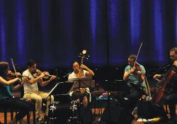 Liu Fang (center) plays the pipa during a rehearsal with the Matangi Quartet.